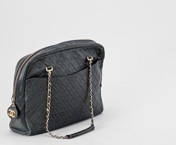A 1970s/80s dark blue quilt leather shoulder bag by Chanel.