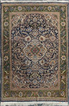 An oriental carpet. Qum. Circa 201x140 cm.