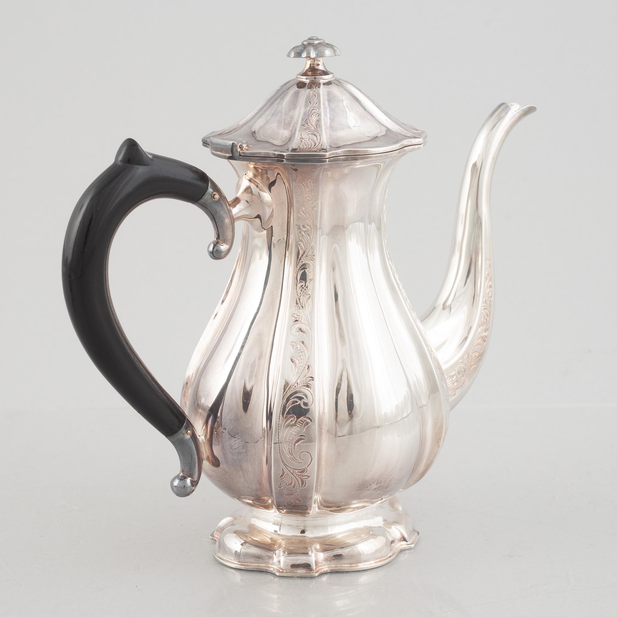 A silver coffee pot, creamer and sugarbowl, Swedish import marks, JL Hultman, circa mid-20th century.