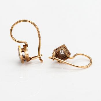 A pair of 18K gold earrings with diamonds ca. 0.08 ct in total.