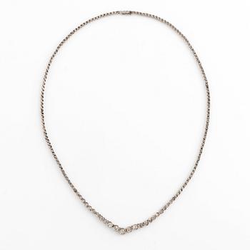 An 18K white gold and old-cut diamond rivière necklace.