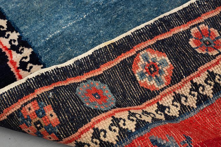 Matto, a saddle cover/a rug, semi-antique/old China, ca 129 x 63 cm.