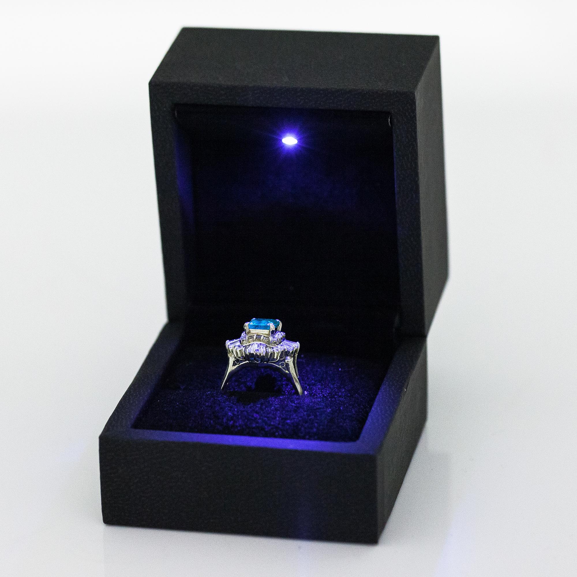 A platinum ring with a ca. 1.15 ct emerald and ca. 1.00 cts of diamonds in total.