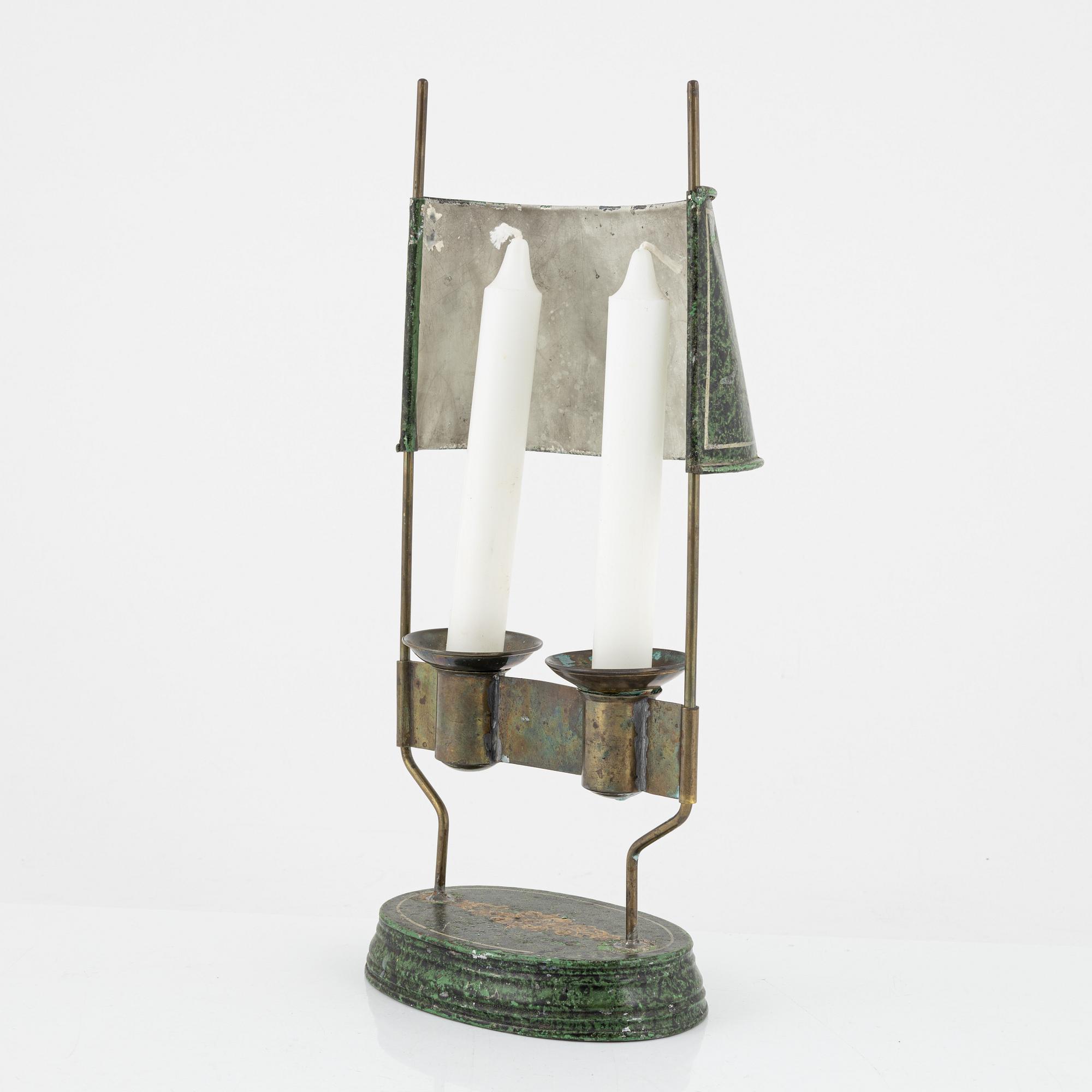 An empire style candlestick, circa 1900.