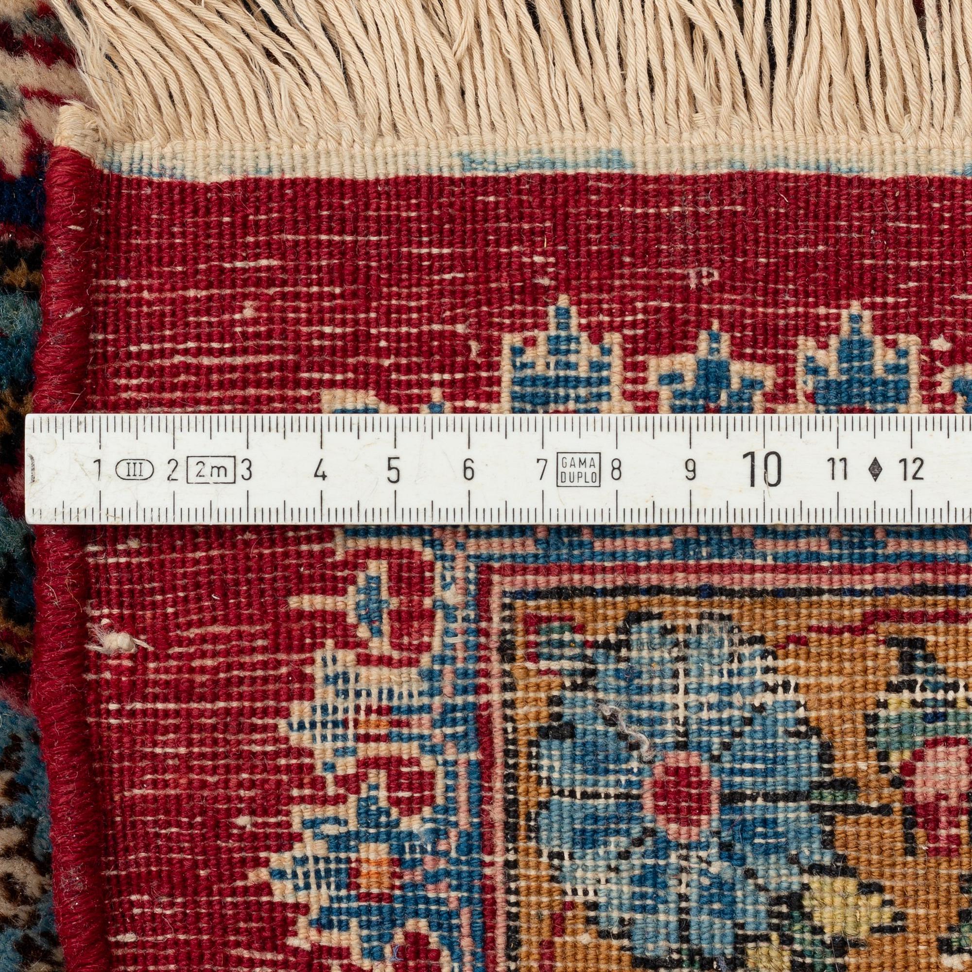 A semi-antique Kerman carpet, ca 431 x 312,5 cm.