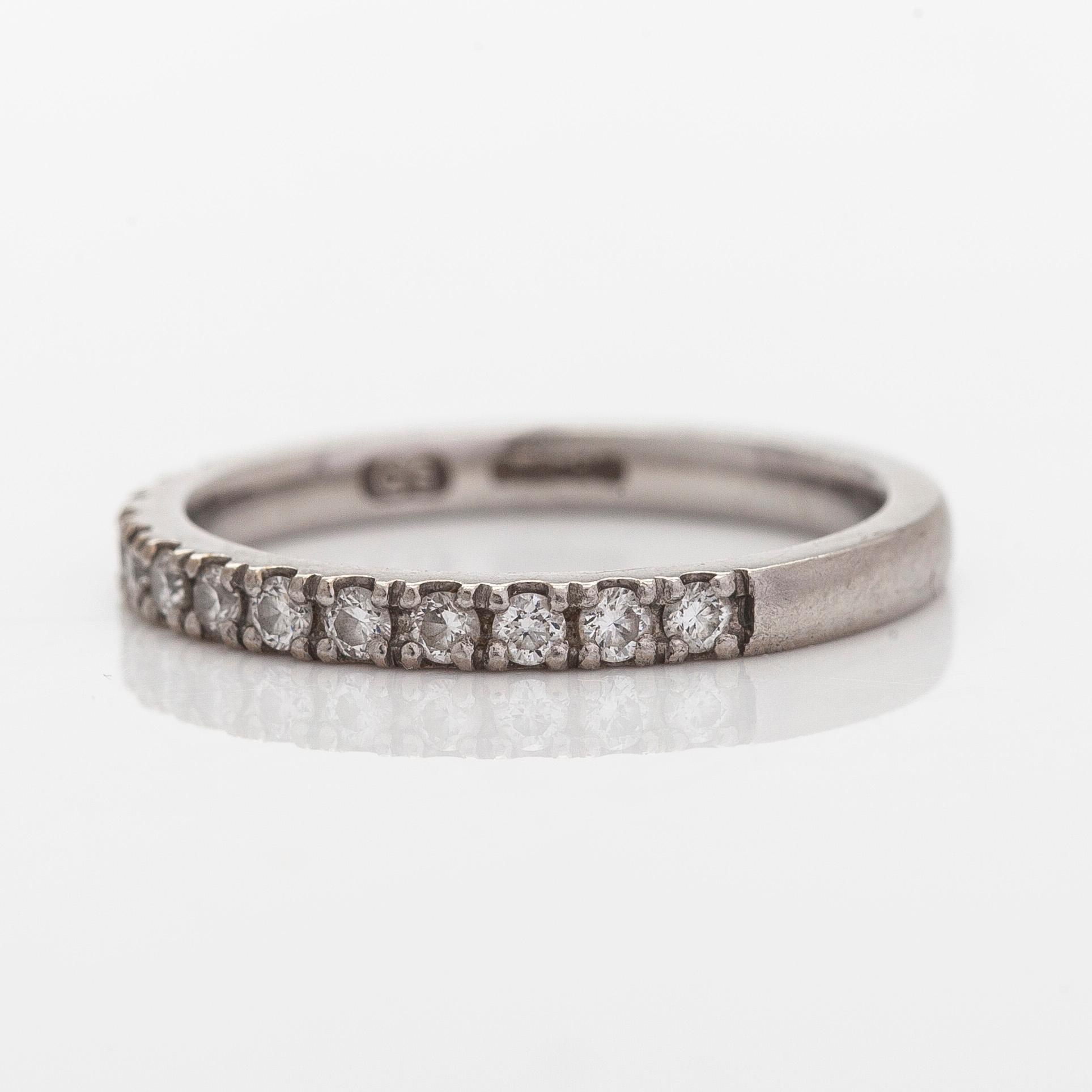 A platinum ring with brilliant cut diamonds.
