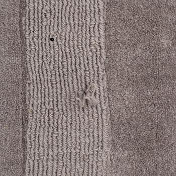 A Layered "Wool Cubes" carpet, 390x620 cm.