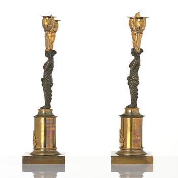 A pair of Swedish Empire ormolu and patinated two-branch candelabra, Stockholm, early 19th century.
