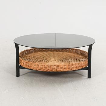 A late 20th century glas, metal and wicker coffee table.