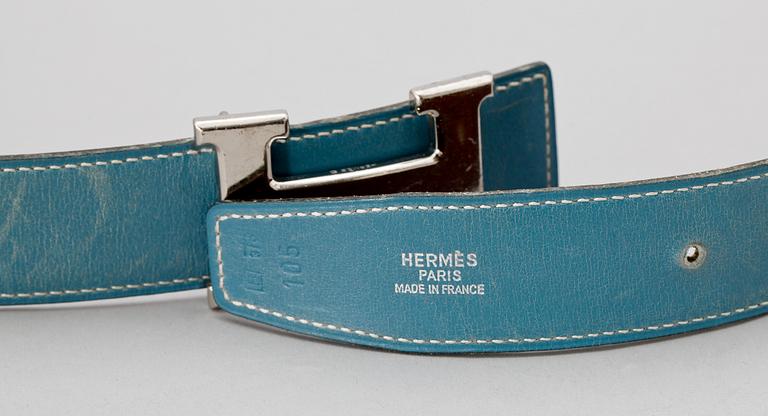 A light blue leather belt by Hermès.