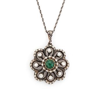 478. A silver pendant set with a cabochon-cut emerald and rose-cut diamonds.