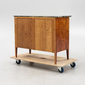 A mahogany and birch veneered dresser with a stone top.