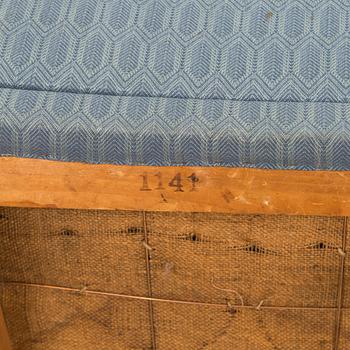 A pair of mid-20th century armchairs.