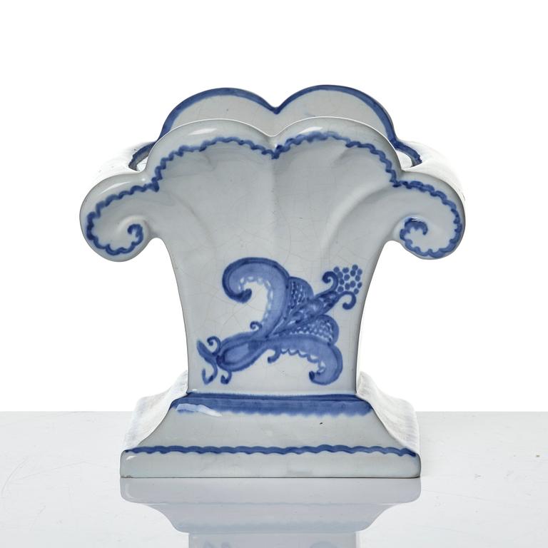 Wilhelm Kåge, eleven pieces of faience including jars, inkwells and a tulip vase, Gustavsberg, Sweden, 1919-1920.