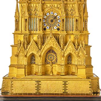 A Charles X ormolu mantel clock modelled as the Cathedral of Reims, Paris, 1820's.