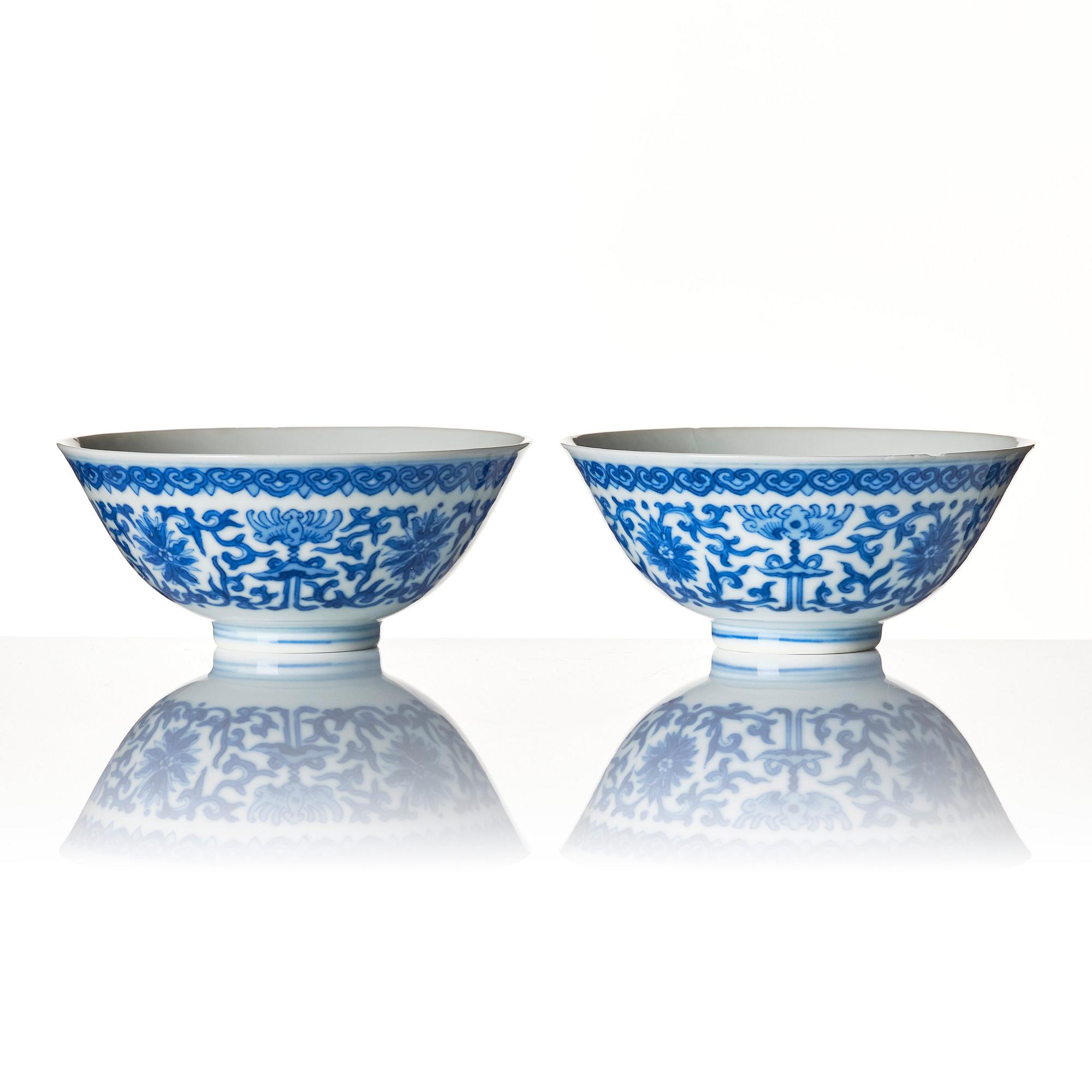 A pair of blue and white lotus bowls, Qing dynasty with Daoguang mark.