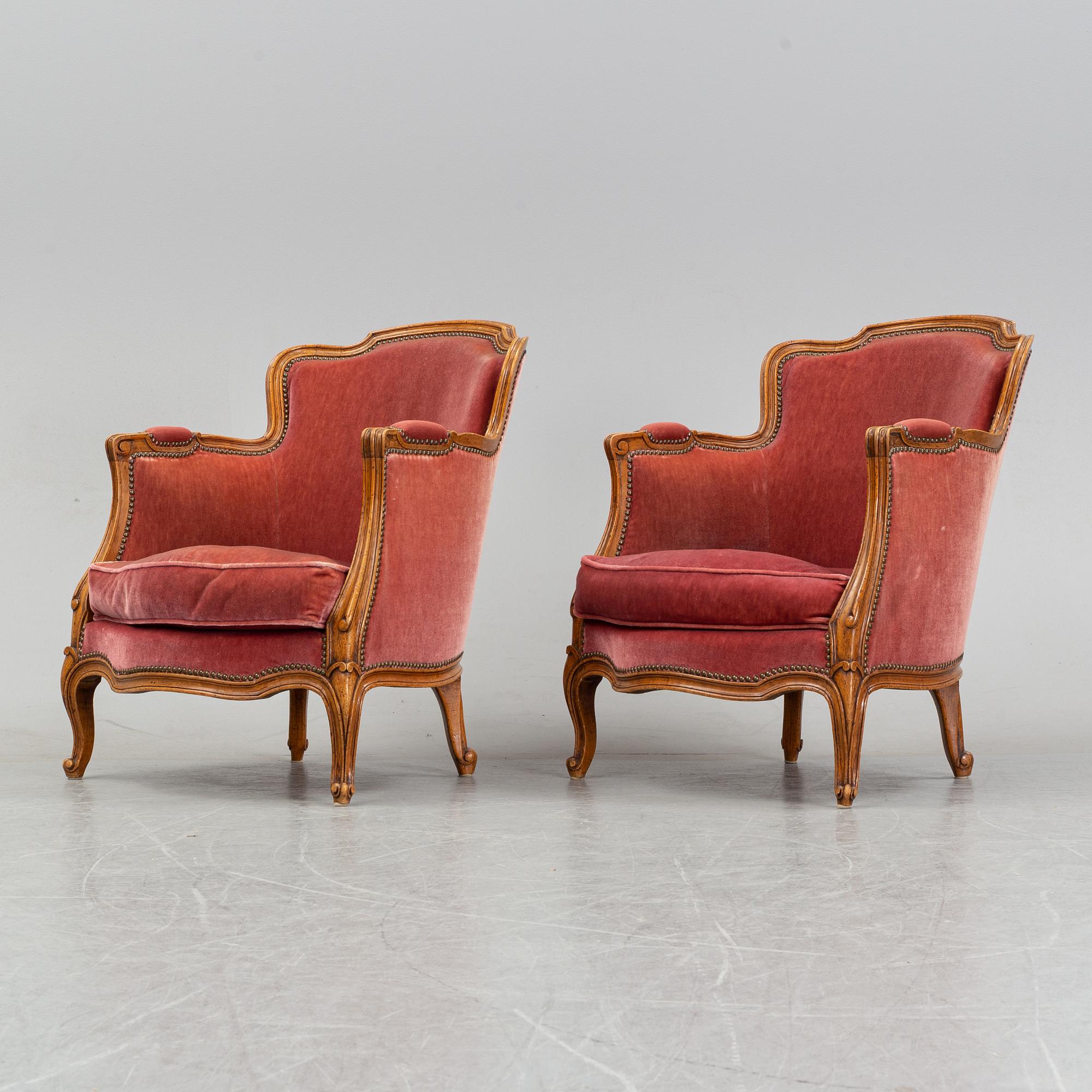 A pair of rococo style easy chairs from around the year 1900.