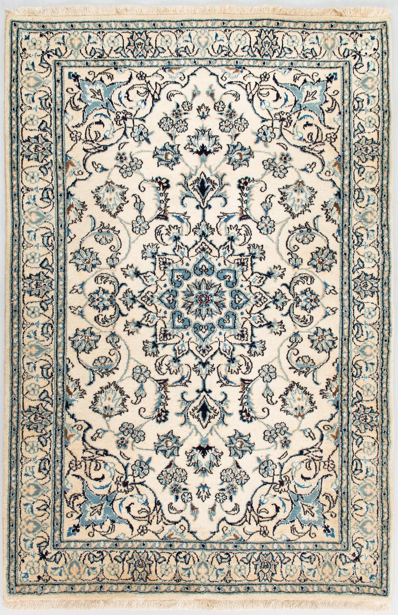A carpet, Nain Part Silk. Ca 185 x 123 cm.