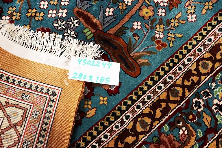 An all silk oriental carpet, a. 280 x 185 cm.