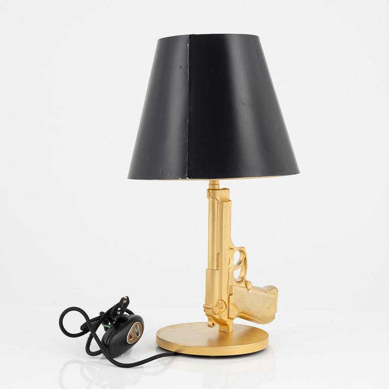 Philippe Starck, a 'Gun bedside Lamp' table light, Flos, Italy.