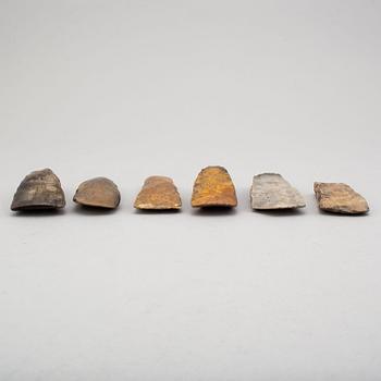 Six neolithic flint axes.