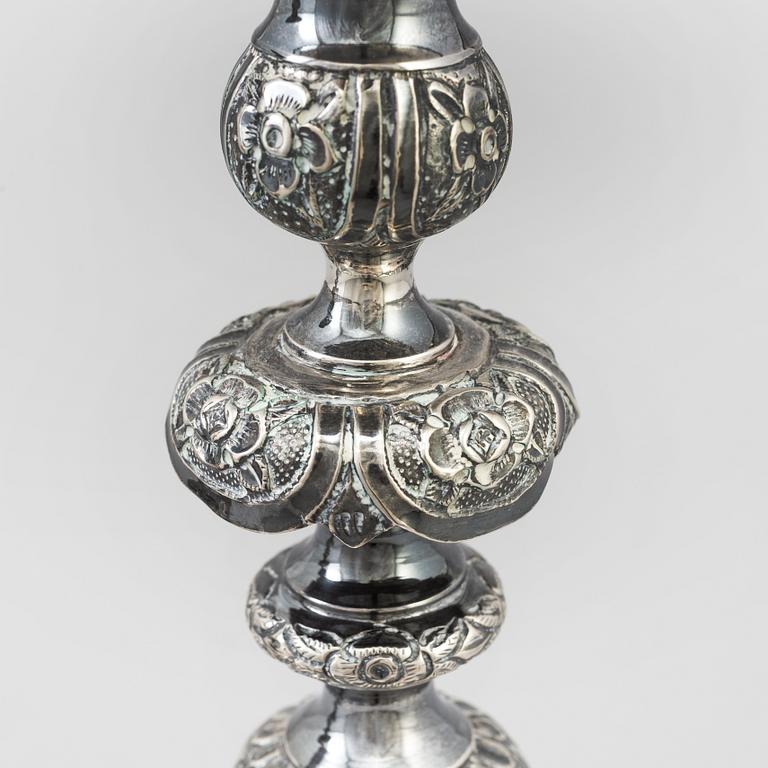 A pair of silver Sabbath candlesticks, Maker M. Sztern, Warsaw, Poland. Assayer Josef Sosnkowski, 1864. Weight 833 g.