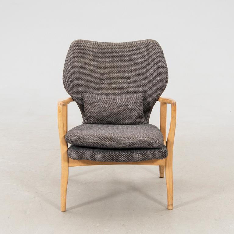 Armchair with armrests, modern manufacture.