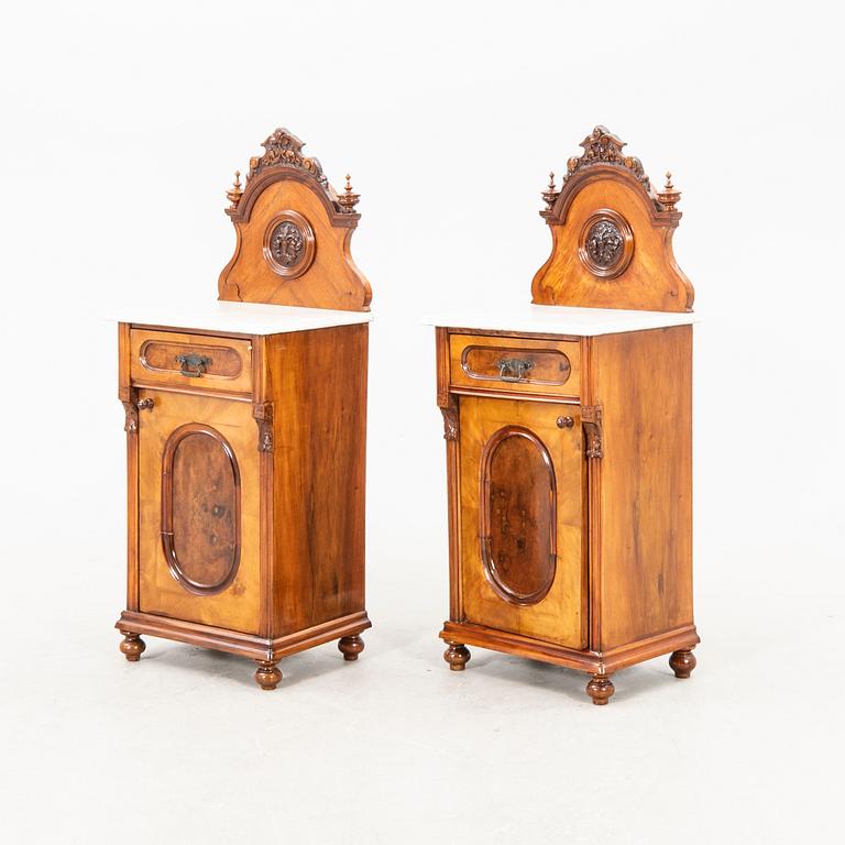 A pair of lacquered walnut and marble bedside tables from the first half of the 20th cenutry.