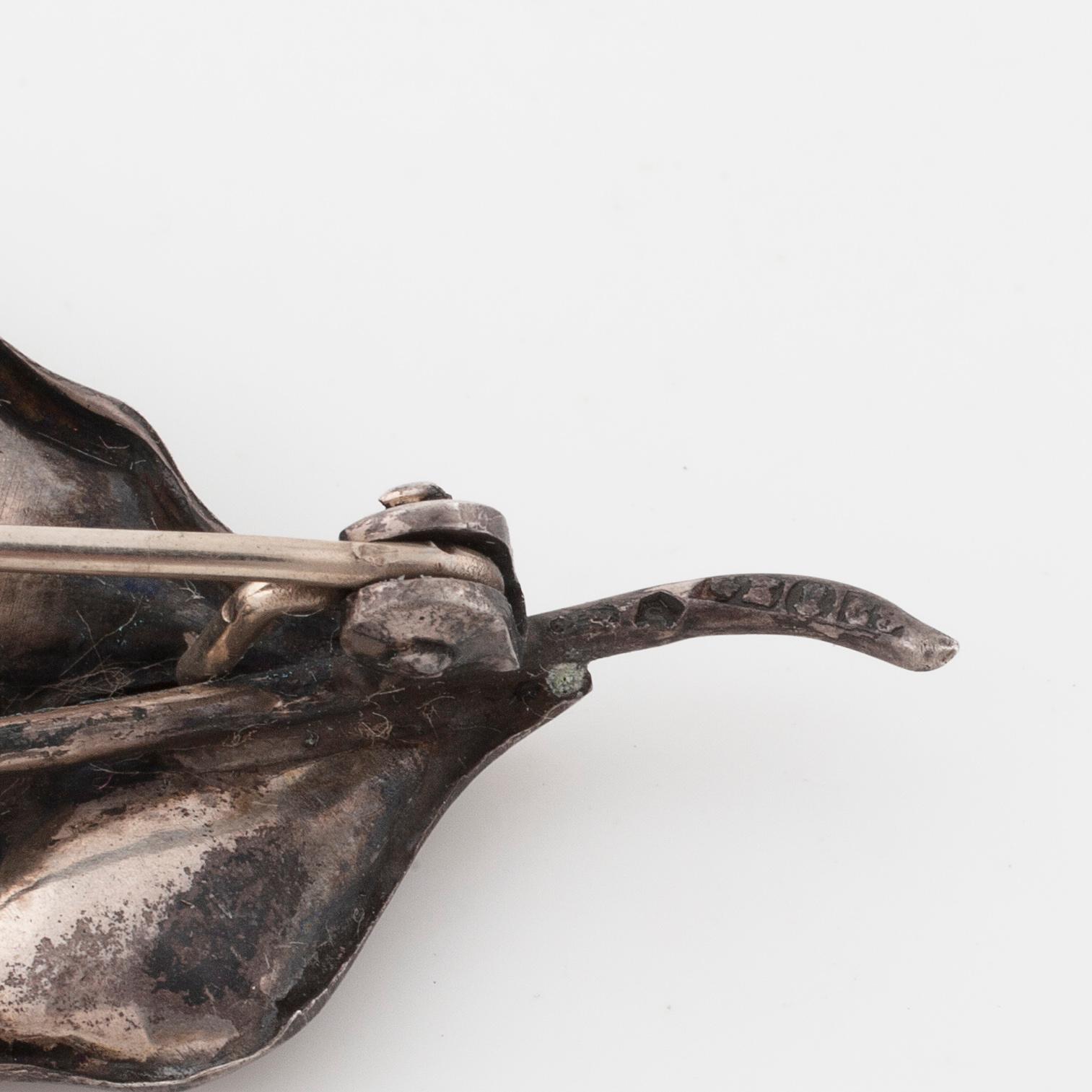 A brooch and a pair of earrings by Georg Kaplan, Stockholm.