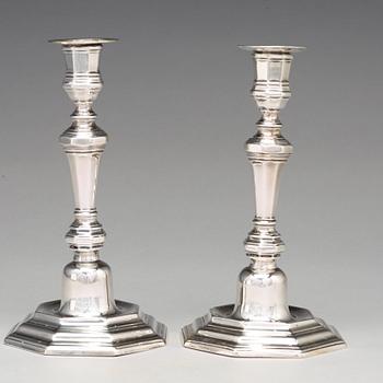 A pair of European 18th century silver candlesticks, unidentified makers mark.