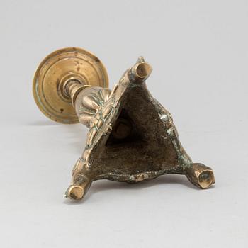 A 17th century bronze candlestick.