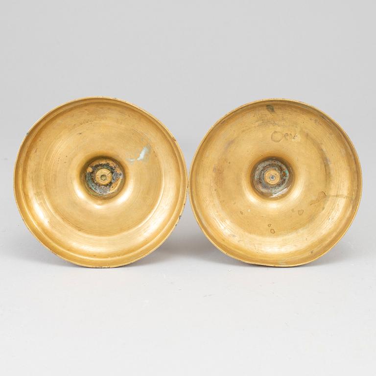 A pair of bronze candlesticks, first half of the 19th century.