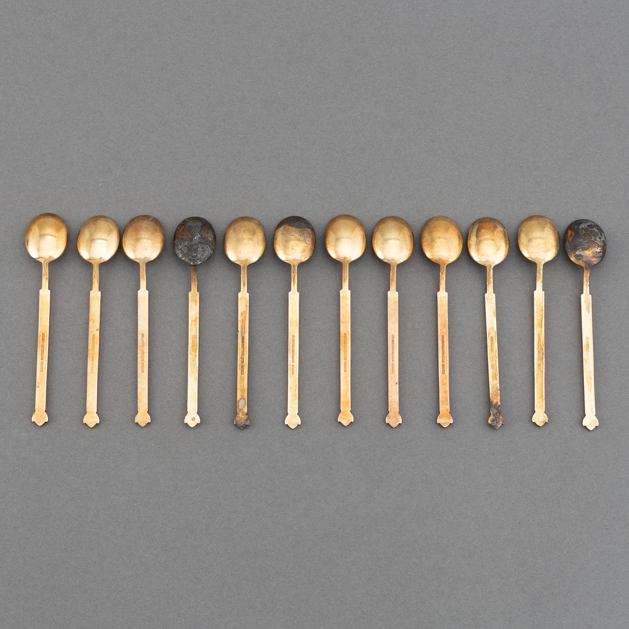 A mixed lot of 35 silver spoons, a tea strainer and two small dishes, parcel-gilt guilloché enamel, Norway, 20th century.