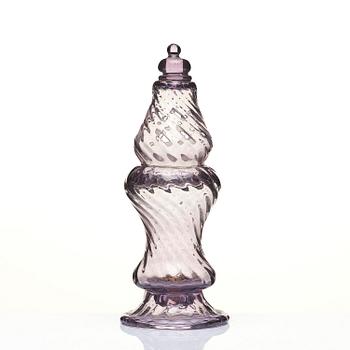 An amethyst coloured suger shaker and a cut glass goblet, 18th century.