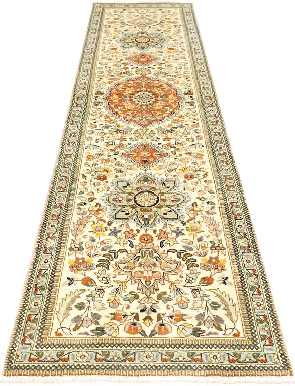 A Tabriz runner, c. 320 x 75 cm.