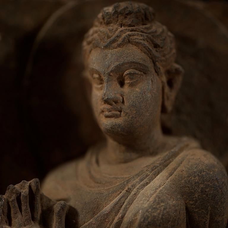 A schist relief with Buddha and attendants,
Gandhara, presumably 2nd/3rd century.