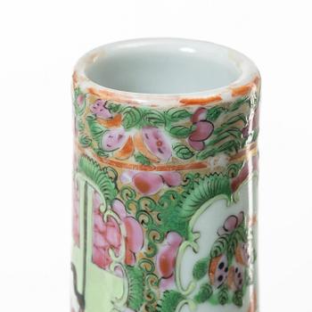 Two famille rose 'Canton' vases with covers, Qing dynasty, 19th century.