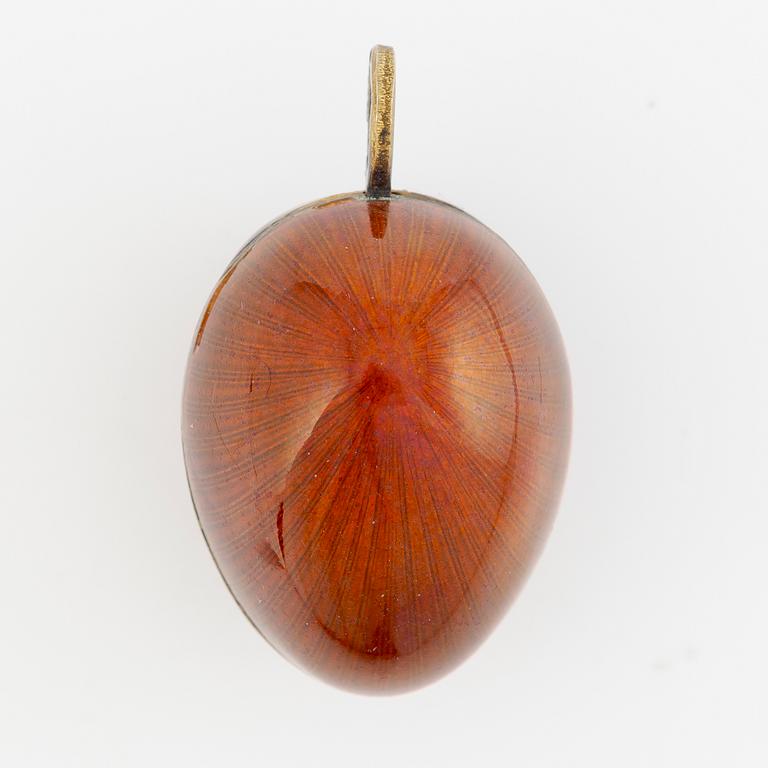 Pendant, in the form of an egg, A. Tillander, gilded silver and red enamel, Finland 1977.