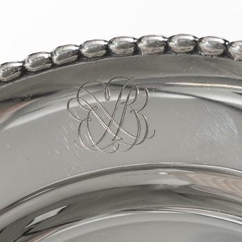 12 plates and 12 side plates, silver, marks of GAB and Edlund's silverware factory, Stockholm 1946 and 1974.