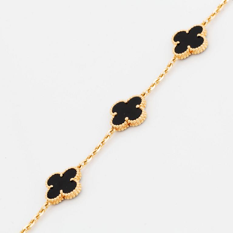 A Van Cleef & Arpels "Alhambra" bracelet in 18K gold and onyx.