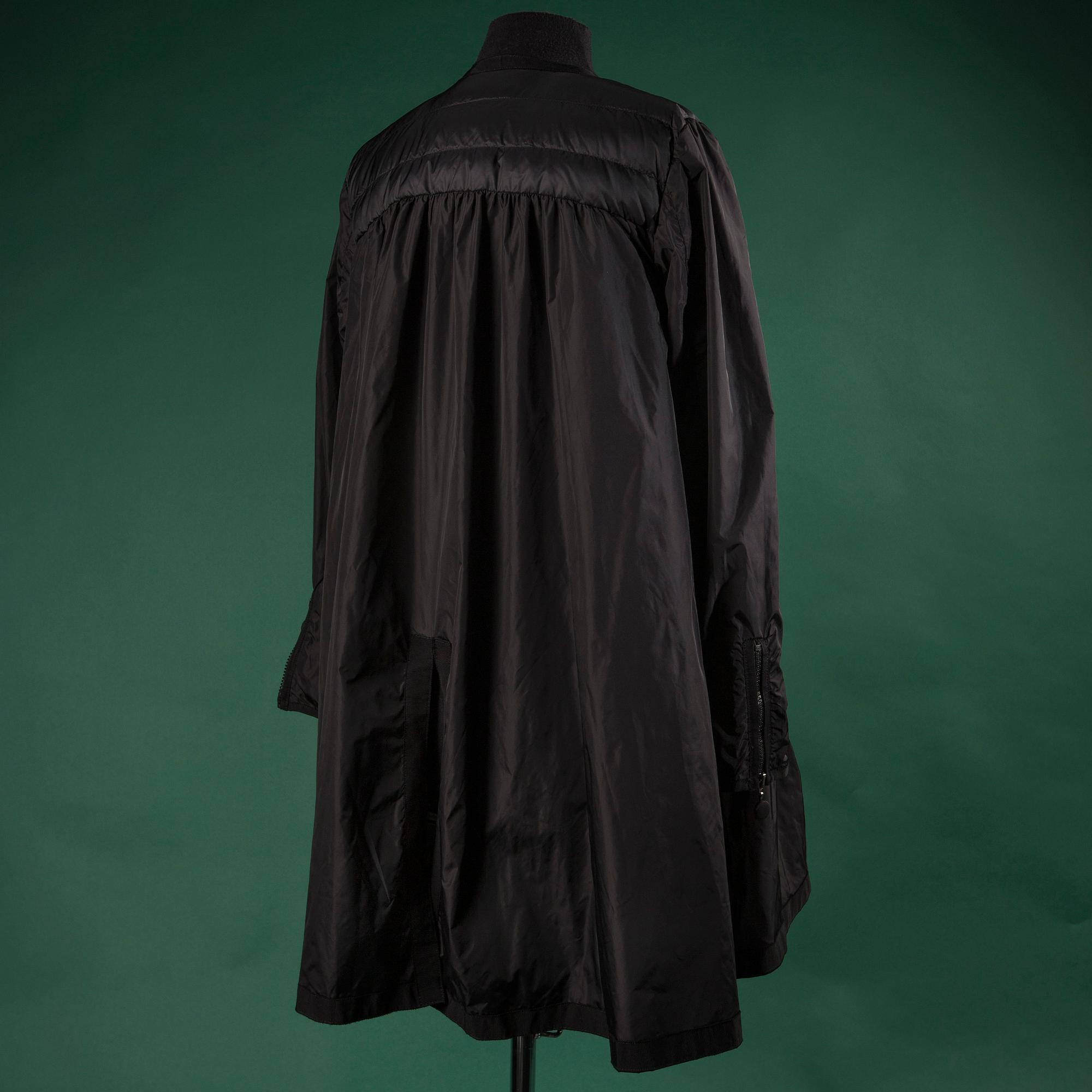 A jacket by MONCLEAR, size 3.