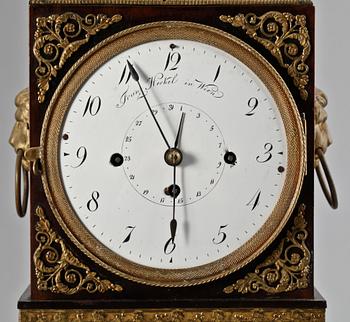 An Austrian Empire mantel clock.