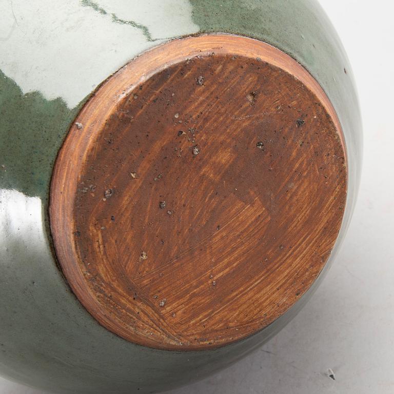 A Japanese eraly 20th century stoneware jar.
