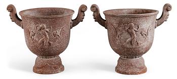 598. Ivar Johnsson, A pair of Ivar Johnsson cast iron urns 'Faunurnan' for Näfveqvarns bruk.