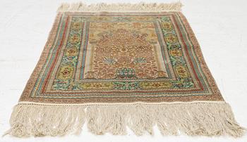 A semi-antique silk Hereke, c. 92 x 61 cm.