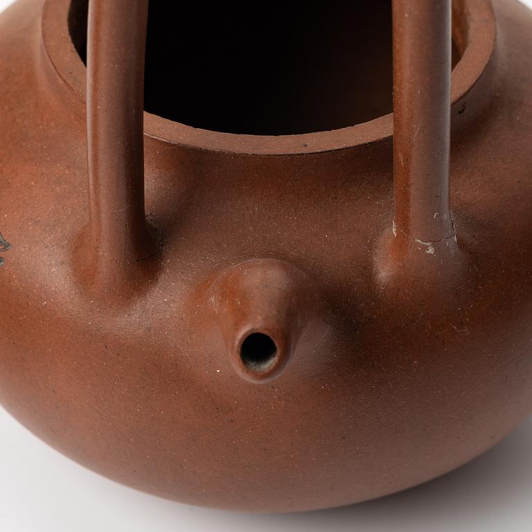 Two Chinese yixing teapots, early 1900s and 1980s.