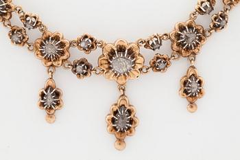 A necklace set with rose-cut diamonds.