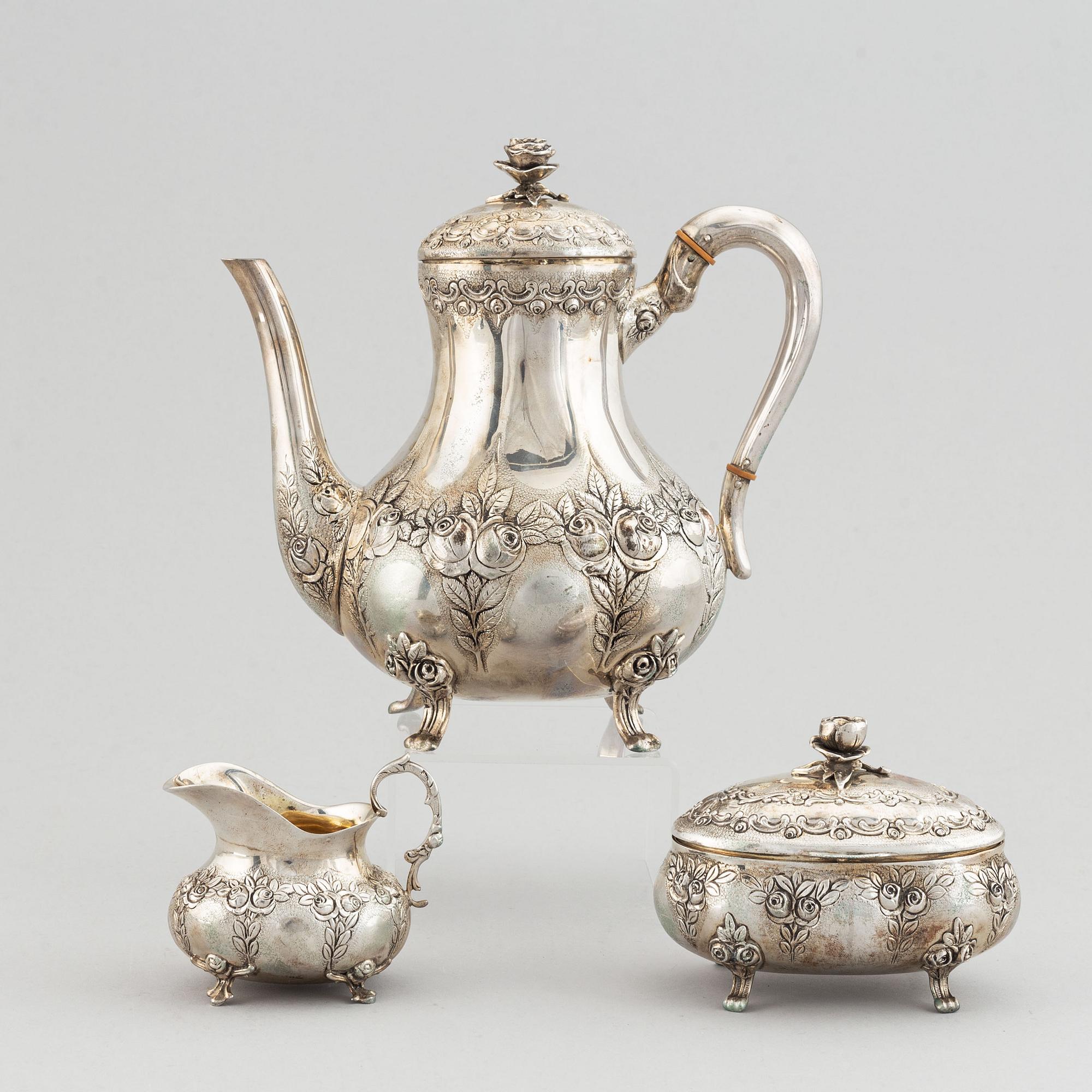 A rococo-style coffee pot, creamer and sugar bowl, swedish import mark, 20th century.