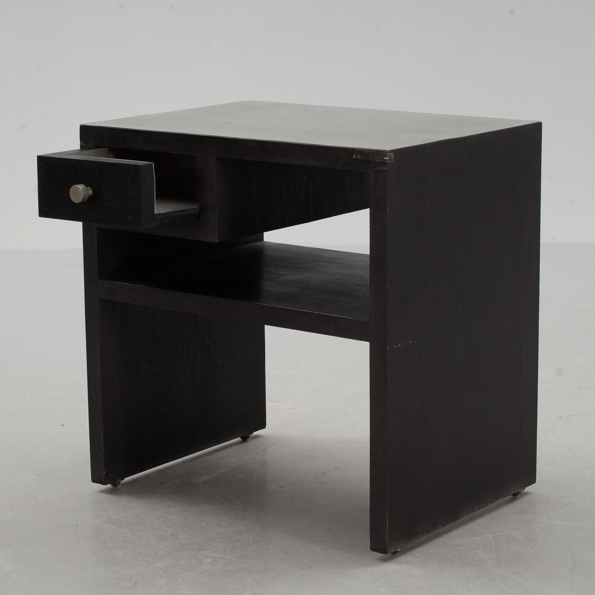 An Uno Åhrén black lacquered birch and pewter side table, Svenskt Tenn, Stockholm ca 1930.