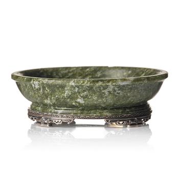 1236. A spinach green stone dish with silver mounting, late Qing dynasty / around 1900. Lebkuecher & Co Newark c 1896-1909.